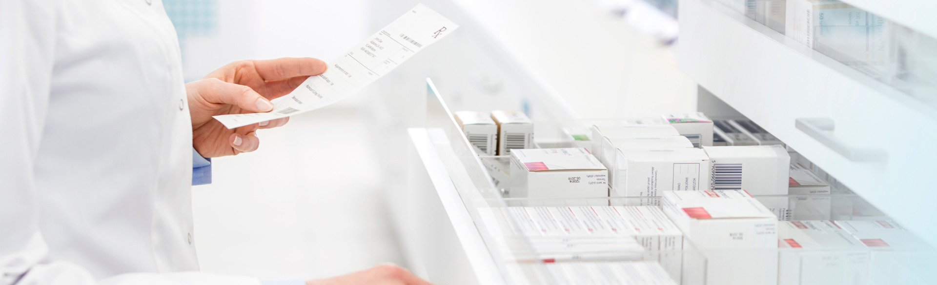 pharmacist filling a prescription in a pharmacy
