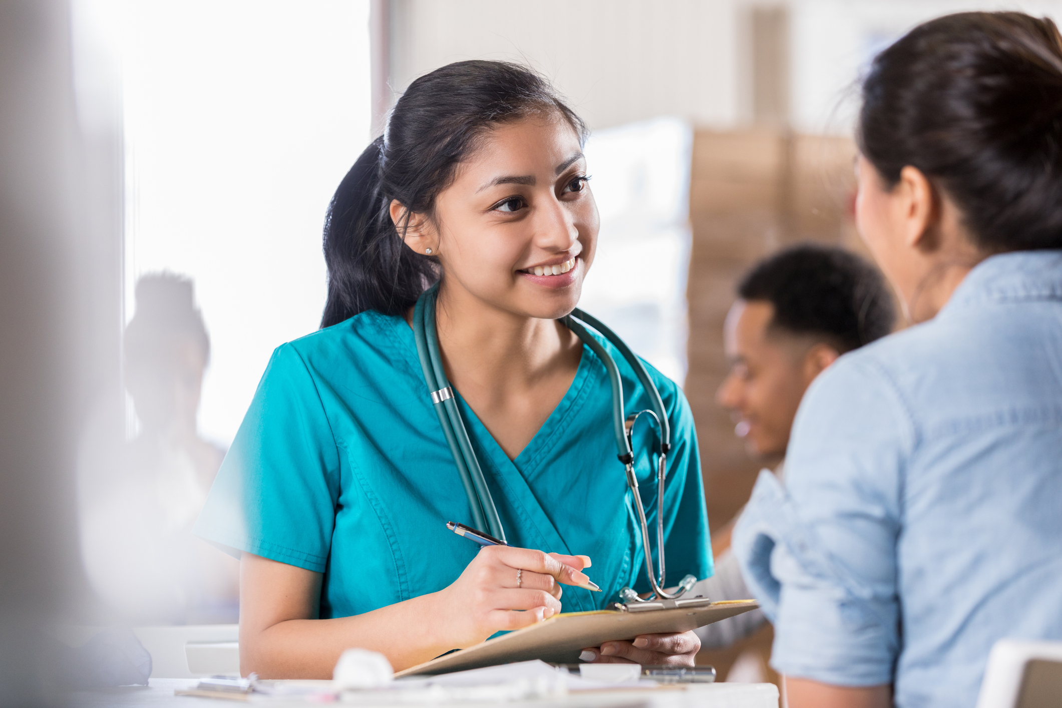 nurse talking with patient