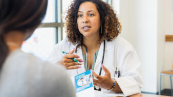 Nurse practitioner speaking with a patient
